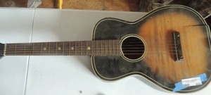 lot 404 image: Guitar 6 strings has crack silvertone 319.12049 vintage sunburst usa