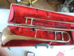 lot 421 image: Ault artist trombone has dents, no mouth piece in case
