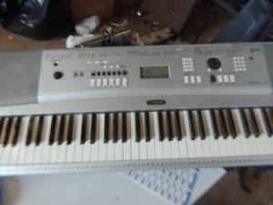 lot 812 image: Yamaha portable grand- DGX2301- power cord