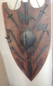 lot 460 image: Mid Evil shield plaque with  Helmet - Knives - Axe