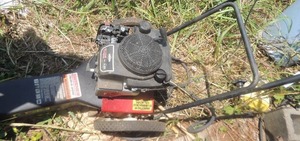 lot 1498 image: BRIGGS & STRATION 625 SERIES  SWISHER TRIM N MOW  6.25 HP, WHEELS WARPED