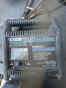 lot 1579 image: excied battery charger and motion detector