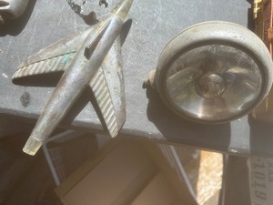 lot 1587 image: Vintage airplane hood ornament  & vintage  head light