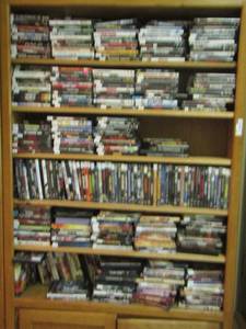lot 207 image: 844212 bookshelf FULL OF DVDs