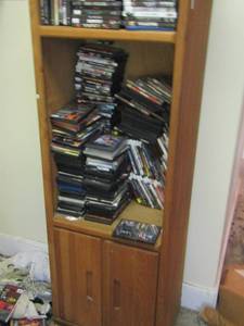 lot 208 image: single book shelf full of DVDs for all your familys liking