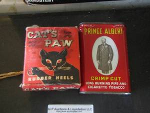 lot 230 image: cats paw rubber heels, prince albert long burning pipe and cigarette tobacco tin can