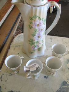 lot 260 image: CHOCOLATE SET handled pot  &  4 handled floral coffee cups