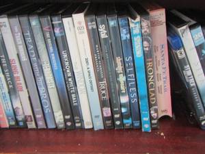 lot 303 image: shelf of dvds