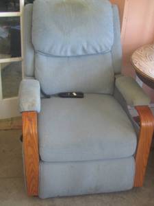 lot 355 image: blue lift chair with a stain on the head part