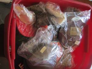 lot 590 image: red tote of various hats