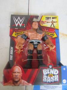 lot 644 image: WWE The ROCK  bend n bash figurine