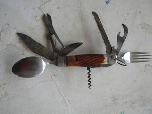 lot 686 image: multi tool knife with eating utensils as well