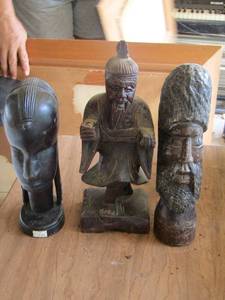 lot 1097 image: carved wooden statues