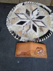 lot 1111 image: hand woven hot pot and a small brown leather wallet