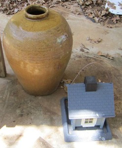 lot 1676 image: small blue bird house, large yellow pottery vase