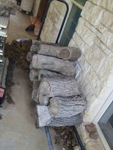 lot 1683 image: wood log holder with a few pieces of wood