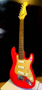 lot 283 image: FENDER SQUIER MINI Stratocaster Red Electric Guitar (NEEDS STRINGS) $$