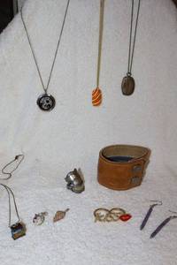 lot 54 image: Novelty Jewelry leather cuff with zipper pouch, double band Kiss ring, necklaces and more