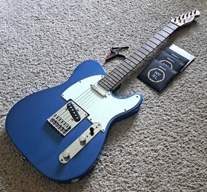 lot 3 image: Squier telecaster by Fender electric guitar with extra strings plus