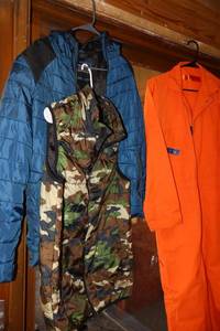 lot 30 image: Puffer jackets and orange work suit