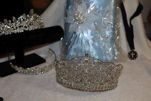 lot 51 image: Quinceaera lot tiaras, Bible and  cross of color necklace