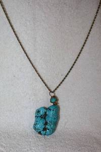 lot 58 image: Jewelry Large turquoise Pendant necklace. Untested 2 stone with gold chain marked 14K Italy.