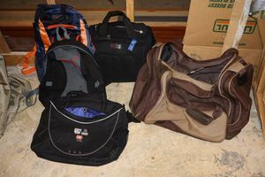 lot 25 image: Cavenders duffle bag, backpacks and computer bags as shown