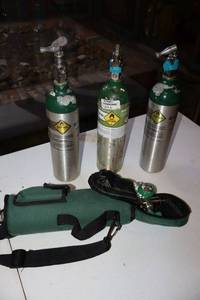 lot 39 image: Oxygen tanks, one with carrier as shown