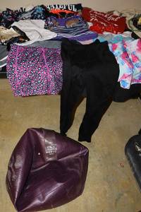 lot 135 image: Womens workout clothes  mixed sizes, plus exercise ball and stretch band