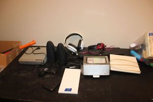 lot 217 image: Electronics Garmin, headphones, computer speakers, DVD player