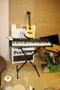 lot 228 image: Electric keyboard and stand plus toy guitar