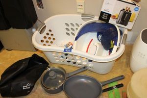 lot 234 image: Cooking pans, Foot soaker, toaster, and iron with laundry basket