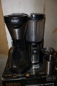 lot 239 image: Ninja coffee machine with travel mug