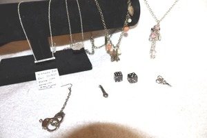 lot 88 image: Jewelry novelty pieces including Harry Potter gold plated necklace
