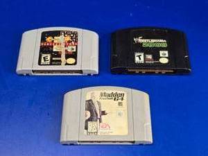 lot 107 image: Lot of 3 Nintendo 64 Game Cartridges.  Includes Wrestlemania 2000, Madden Football 64 & Namco Museum 64