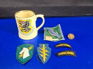 lot 159 image: Lot of Misc Military Patches, Pins & 81st Tactical Fighter Wing Mug