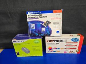 lot 241 image: Vintage Computer Equipment Lot.  Includes 3Com Network Interface Card, SIIG Fast Parallel Support Adapter & Netgear Ethernet Bridge