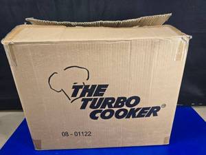 lot 253 image: NEW IN BOX.  The Turbo Cooker All-In-One Stainless Steel Pan Cooking System.  100% Complete.