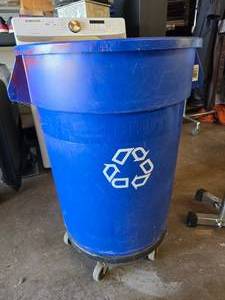 lot 284 image: Rubbermaid Commercial Brute 32 Gallon Blue Trash Can w Trash Can Dolly