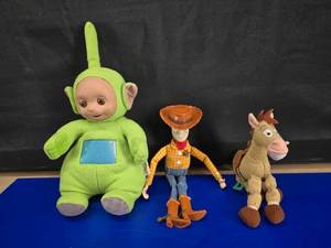 lot 302 image: Plush Lot.  Includes Talking Vintage Teletubbie & OG Toy Story Woody & Bullseye