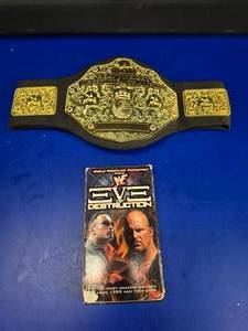 lot 342 image: Kids Wrestling Championship Belt & WWF Eve of Destruction VHS