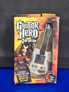 lot 343 image: NEW IN BOX. Guitar Hero 2nd Edition Handheld Game