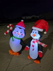 lot 407 image: Lot of 2 Christmas Penguins Inflatables.  Approx 4 Tall.  Tested.
