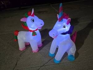 lot 408 image: Lot of 2 Christmas Unicorn Inflatables.  Approx 4 Tall.  Tested.