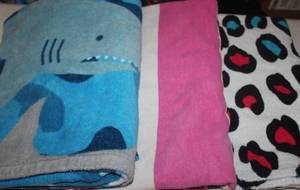lot 35 image: Three Swim Towels, Sharks, Pink and White Stripes and Leopard Print