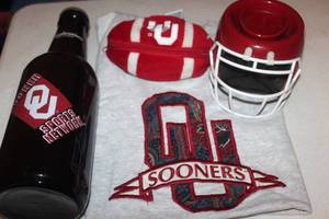 lot 42 image: OU Sooners, T Shirt, Scentsy Warmer, Plush Football and Oversized Budweiser BottleBank