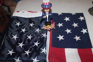 lot 94 image: Two USA Flags and Uncle Sam Bobble Head