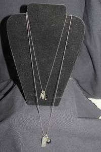 lot 139 image: Two Silver Necklaces with Charms