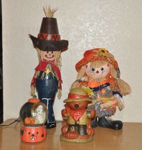 lot 121 image: FallHalloween Dcor Items, Including Musical Globe, and Fiber Optic Scarecrow
