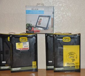 lot 30 image: Four Otter boxes and Tablet Stand